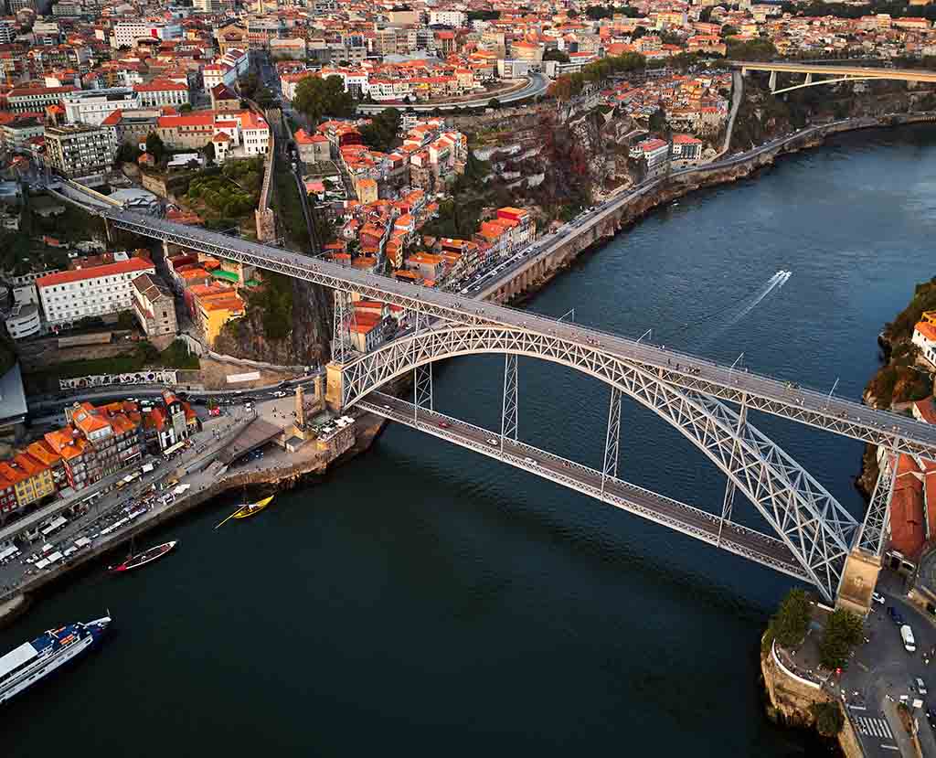 Climbing Torre dos Clérigos: The moment of overlooking the red-tiled roofs of Porto from a height